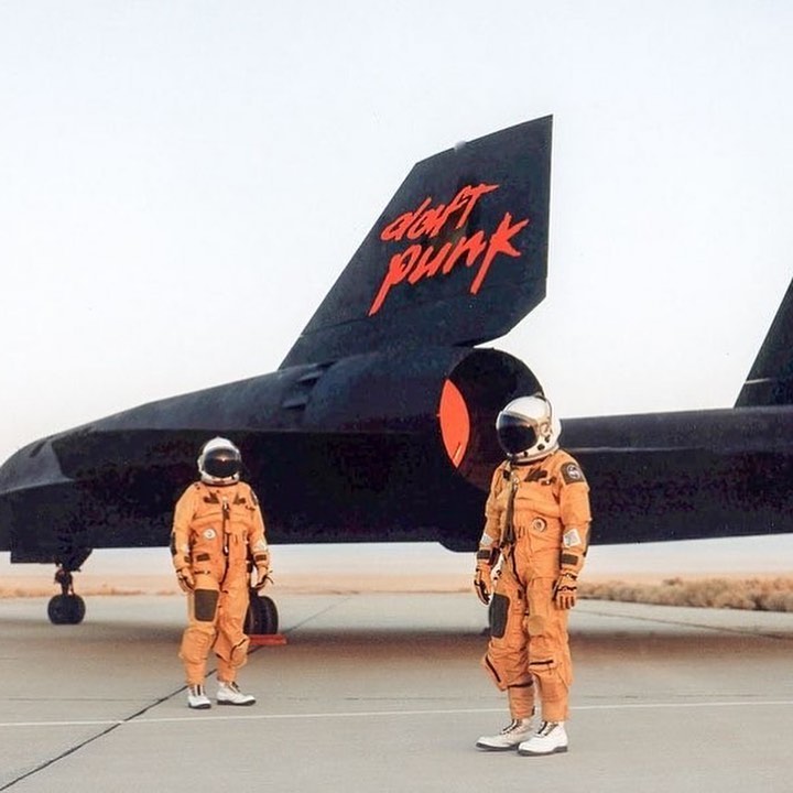 The Real Story Behind That Daft Punk Image

Over the past year or so you’ve probably seen this image circulate amongst your favourite archive pages. It shows two masked figures standing in front of a Daft Punk branded jet of what could potentially be an unreleased project. The French electro duo are known for their epic photo shoots and unannounced music releases so it wouldn’t be out out of the ordinary. This could easily be an interstellar 5555 or Electroma type of project. But look a little closer and it’s clear to see the outfits and helmets aren’t quite the same as the usual get-up of robot helmets and Saint Laurent suits. These are in fact the pilot uniforms of the infamous Blackbird. 

For those who don’t know, the Lockheed SR-71 "Blackbird" is the fastest jet ever built, a machine so far ahead of its time even its own pilots thought it looked more like a spaceship than an airplane. It is an engineering marvel, powered by innovative engines that operated most efficiently at Mach 3.2, its typical cruising speed. It once got from NYC to London in 140 minutes. 

From 1966 to 1998, it operated in secrecy, flown only by a handful of the Air Force's most elite pilots. In the late 80s, then-Lockheed photographer Eric Schulzinger captured these stunning images of SR-71 pilots at Beale AFB wearing their unique Gemini suits. “It was the same suit you'd see astronauts walking into the capsule in, except ours were gold” explains an ex-SR-71 pilot.

Only 32 SR-71 Blackbirds were ever made and although it was a war plane it carried no bombs and it had no gun. It’s job was to fly high and fast over enemy territory, taking pictures without the enemy know it was there. It was so secret that for 10 years no one even knew it existed.

The SR-71 was such a fast, high-flying aircraft that even NASA wanted to take the Blackbird on to do testing of their own. With a service ceiling of 85,000 ft, it could push up to the envelope of where the atmosphere ends and space begins